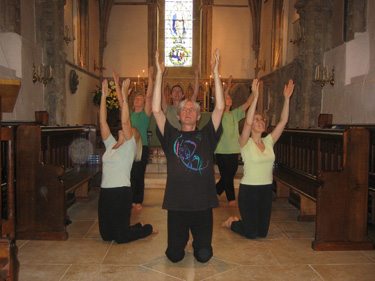 six dancers with arms raised